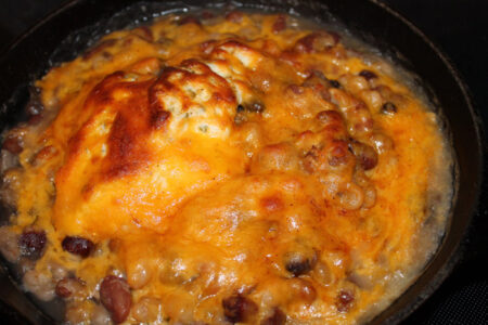 Hot cheesy bean dip with the top bruleed
